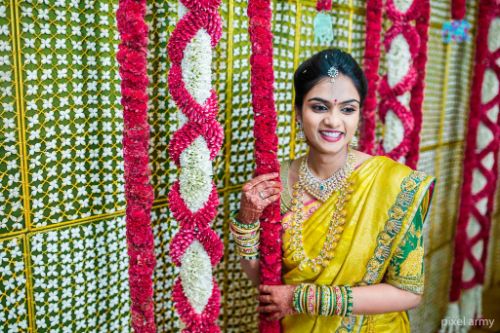 A Colourfully Decked Hall With A Traditional Touch For A Beautiful Engagement!