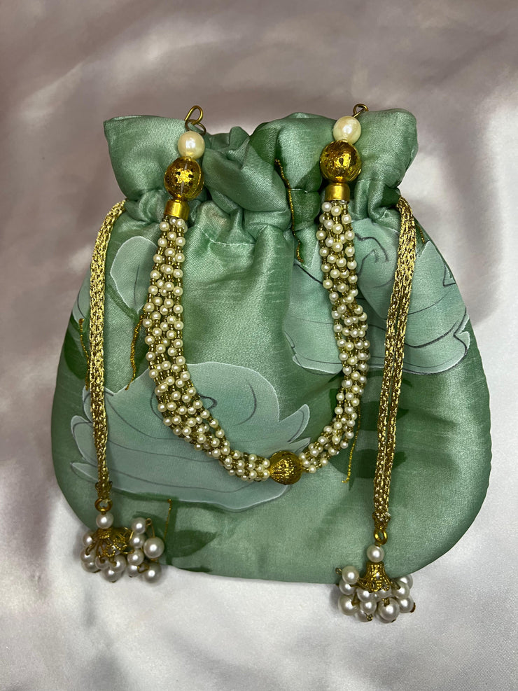 Potli bag made from Organza material with chain handle