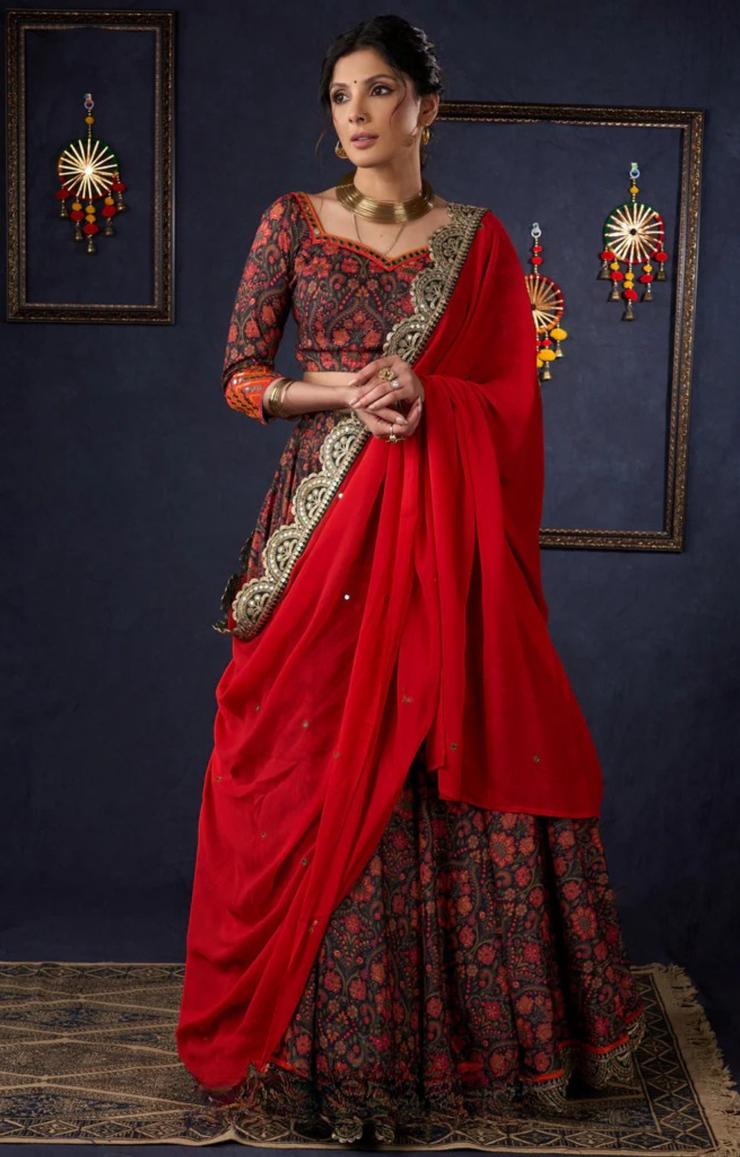 Beautiful Orange Printed Lehenga & Blouse With Mirror Work & Contrast Dupatta.