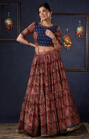 Evergreen Kalamkari Lehenga With Navy Blue Embroidered Blouse & Matching Dupatta.