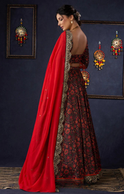 Beautiful Orange Printed Lehenga & Blouse With Mirror Work & Contrast Dupatta.