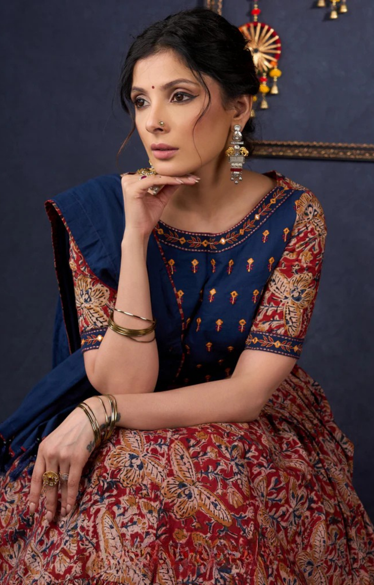 Evergreen Kalamkari Lehenga With Navy Blue Embroidered Blouse & Matching Dupatta.