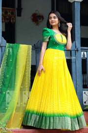 Flowing yellow Bandhani Anarkali dress embodies the essence of Indian craftsmanship.