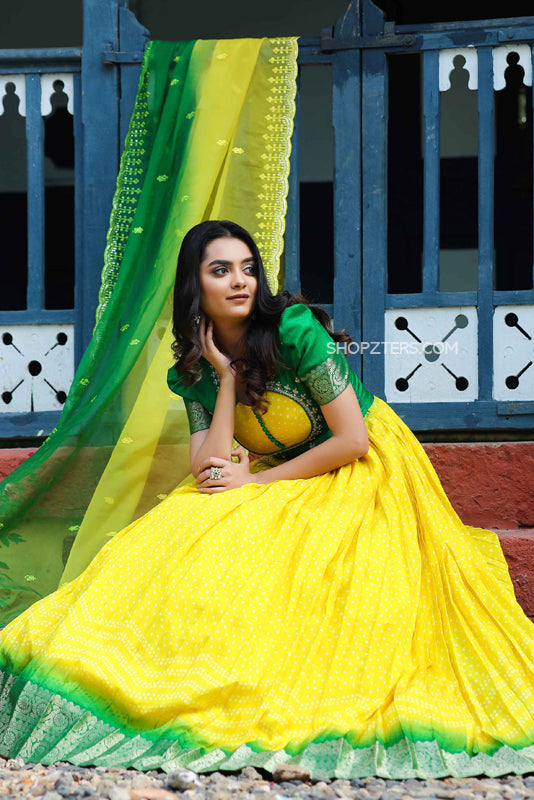 Richly textured yellow Organza Anarkali with authentic Bandhani detailing.