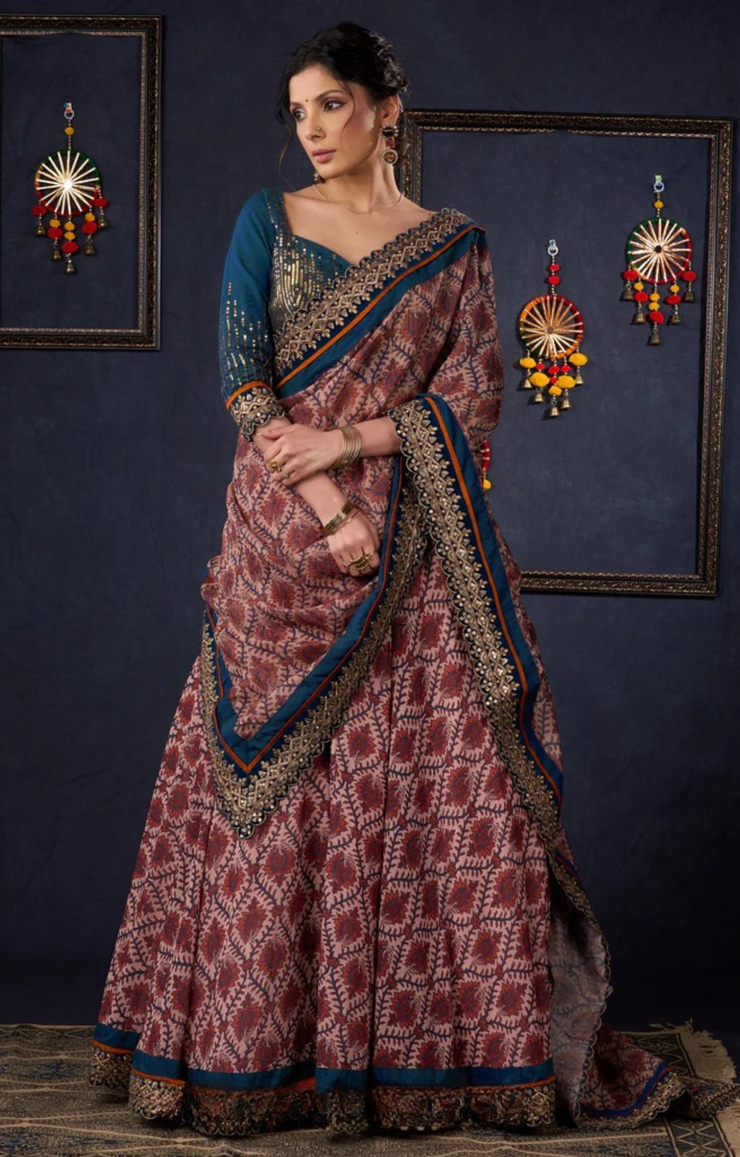 Graceful Printed Lehenga With Gold Embroidered Blouse & Matching Dupatta.