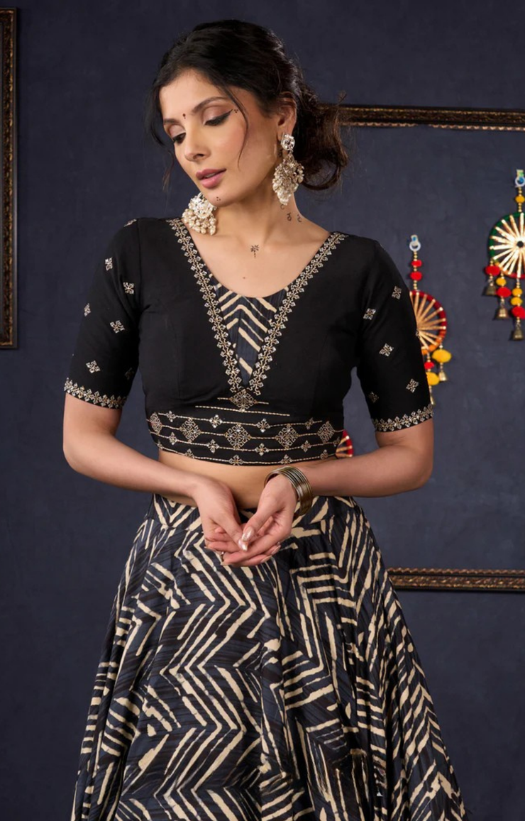 Elegant Black Printed Lehenga With Embroidered Blouse & Net Dupatta.