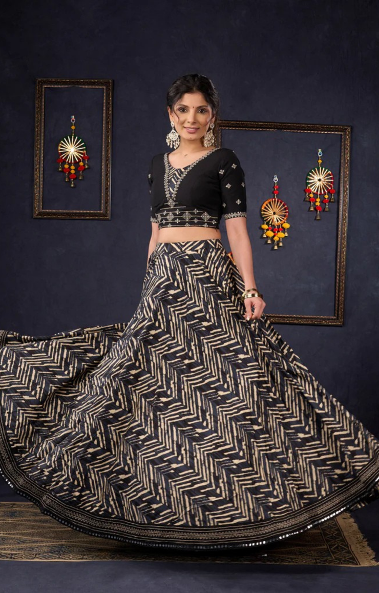 Elegant Black Printed Lehenga With Embroidered Blouse & Net Dupatta.