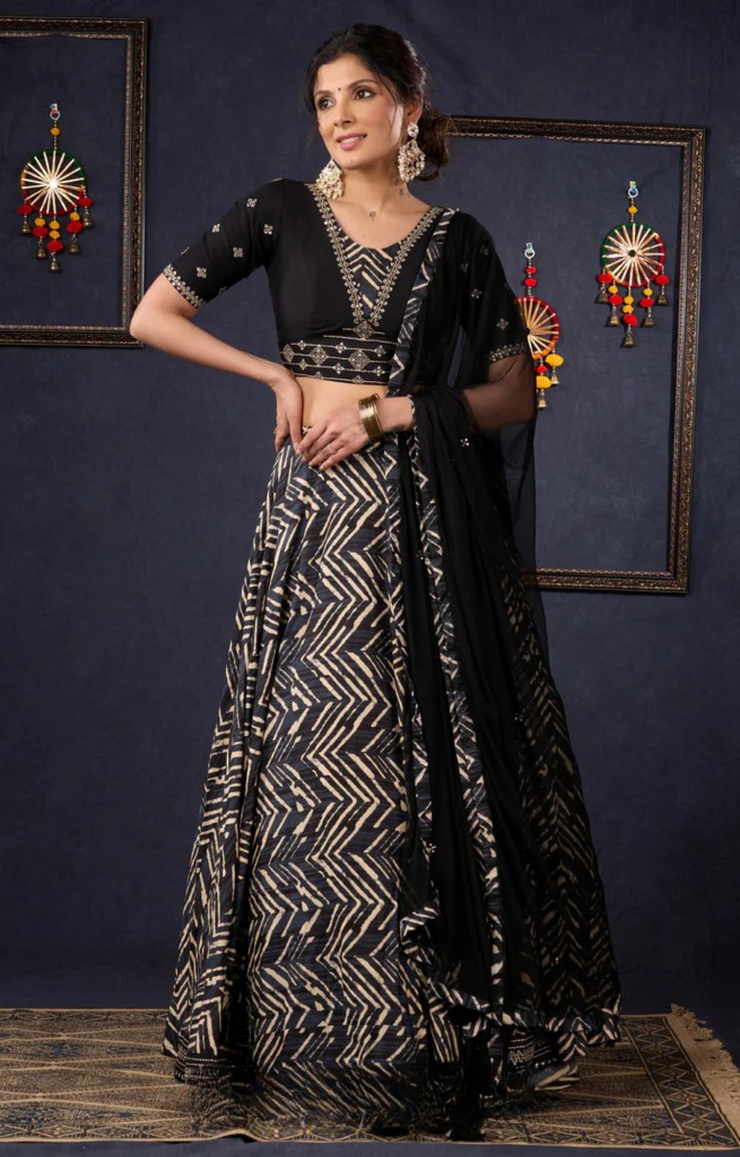 Elegant Black Printed Lehenga With Embroidered Blouse & Net Dupatta.