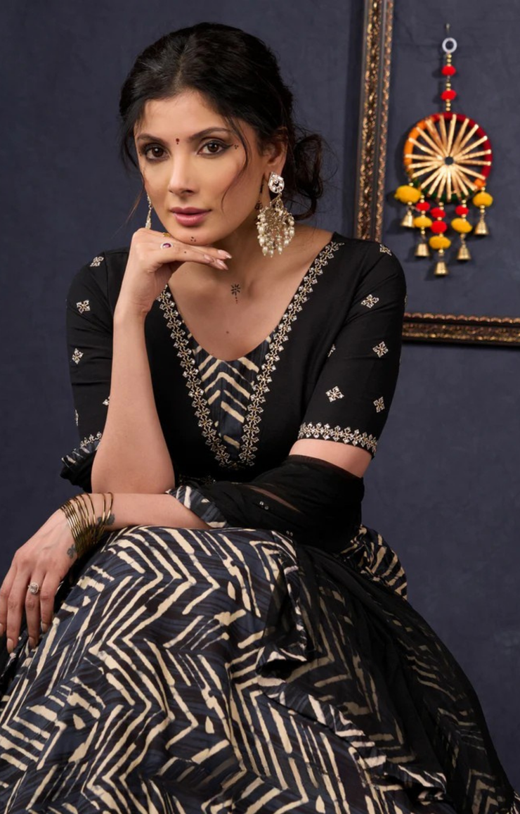 Elegant Black Printed Lehenga With Embroidered Blouse & Net Dupatta.