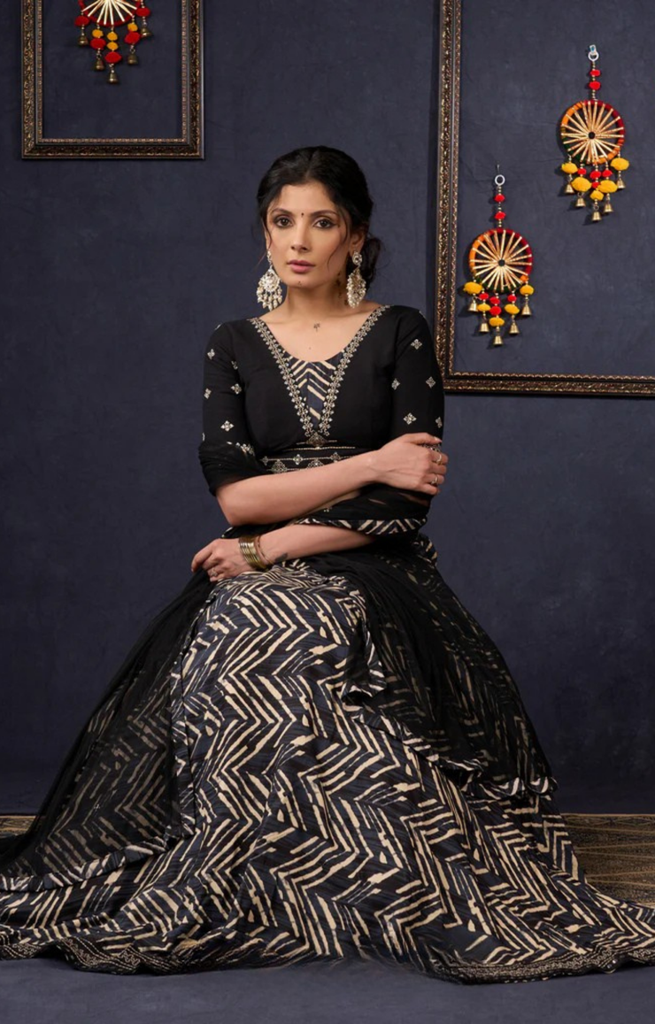 Elegant Black Printed Lehenga With Embroidered Blouse & Net Dupatta.