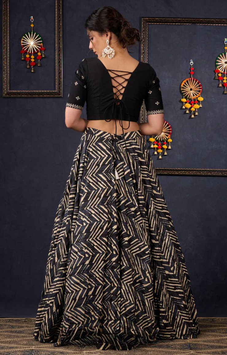 Elegant Black Printed Lehenga With Embroidered Blouse & Net Dupatta.