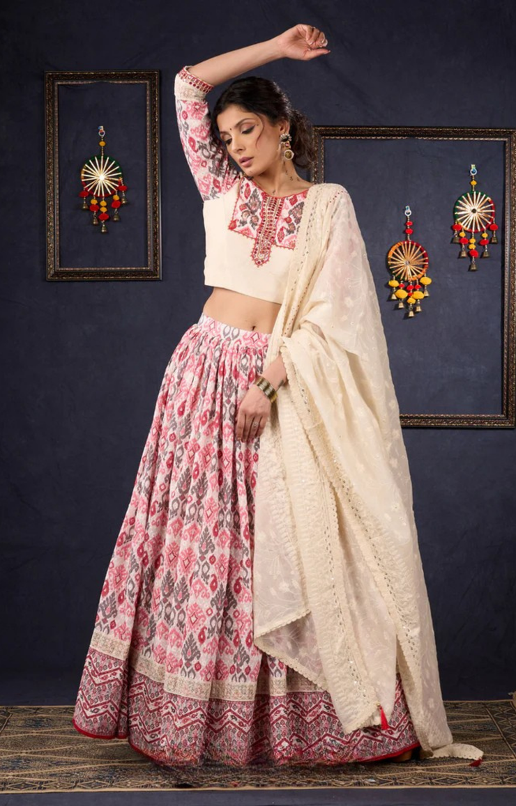 Elegant Off-White & Red Ikat Print Lehenga With Matching Blouse & Dupatta.