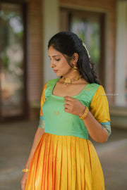 Yellow Semi Silk Dress with Turquoise Zari Yoke