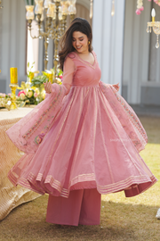 Indian wear for women: Peach organza kurta set that blends culture with contemporary style.