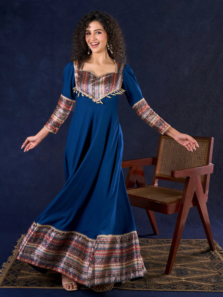 Graceful Navy Blue Rayon Flared Anarkali Gown with Pleated Sleeves & Pearl Accents Graceful Navy Blue Rayon Flared Anarkali Gown with Pleated Sleeves & Pearl Accents
