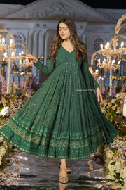 Elegant salwar suit in malachite green, blending traditional charm with contemporary style.