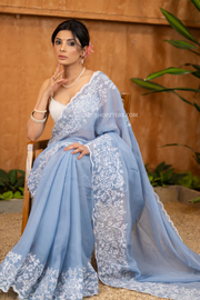 Elegant Powder Blue Organza Saree Highlighted With Overall Intricate Floral Embroidery