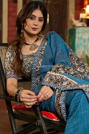 Exclusive Teal blue cotton saree highlighted with kalamkari and indigo borders