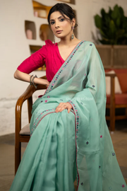Designer Mint Green Organza Saree Highlighted With Overall Multicolour Mirror Embroidery
