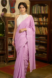 Gracious lilac mul cotton saree with embroidered disty florals and overall scallops