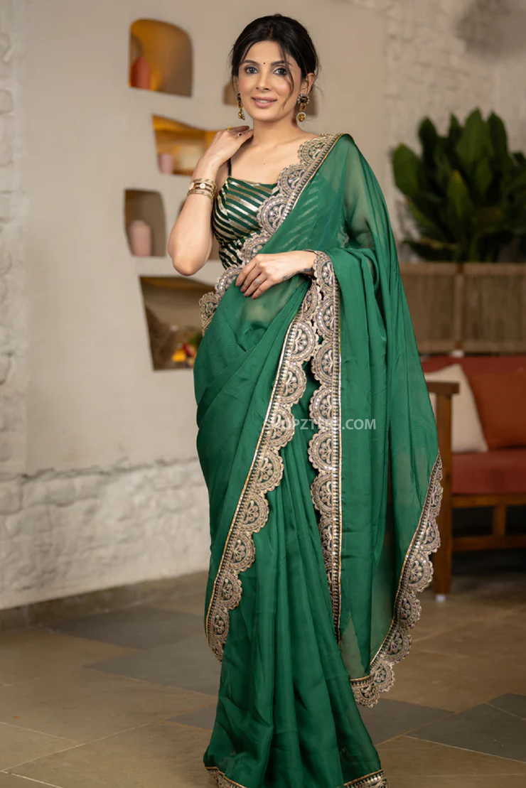 Graceful Bottle Green Organza Saree Highlighted With Matching Scalloped Lace