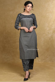Chic Indian wear for women: a gray cotton kurta set with a stylish black Ikat pattern.