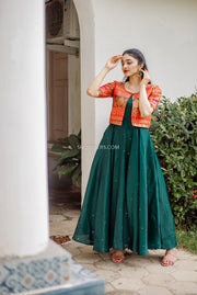 Stunning green silk dress with a red brocade jacket, perfect for adding a touch of elegance to your ethnic wear collection.