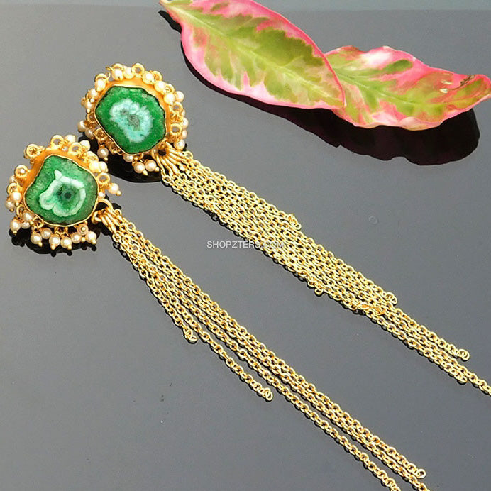 Elegant green stone earrings with gold tassels, perfect for adding sophistication to any outfit.
